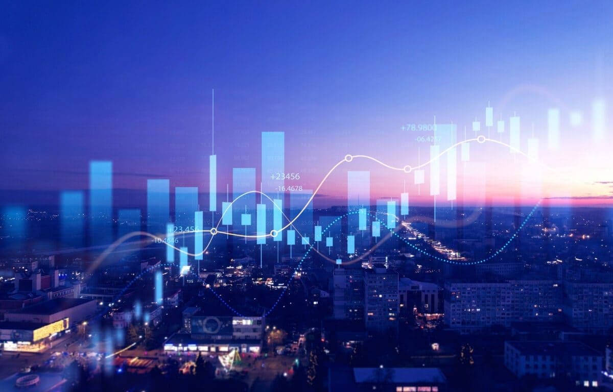 City skyline overlaid with financial charts